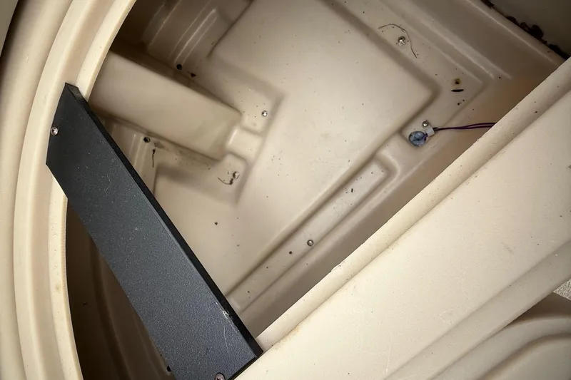 Slide: The Image of Interior view of a 2018 Sweetwater Sunrise 206 F boat, showing wiring and components. - 66