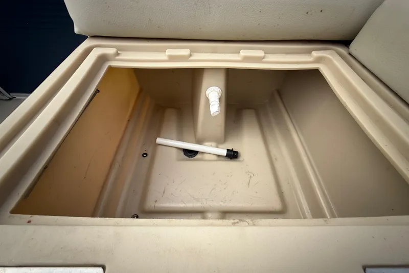 Slide: The Image of 2018 Sweetwater Sunrise 206 F boat interior with storage compartment and speaker. - 68