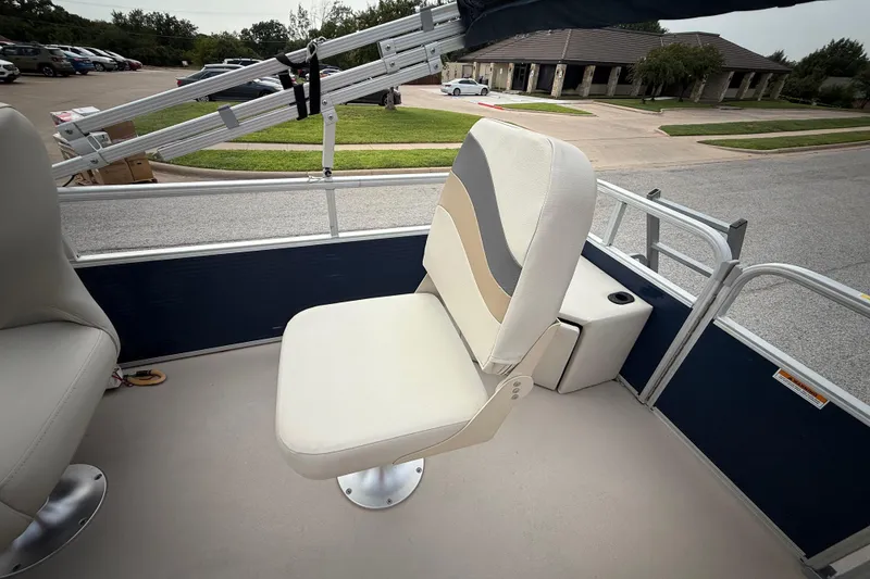 Slide: The Image of 2018 Sweetwater Sunrise 206 F boat interior with seating and storage. - 69