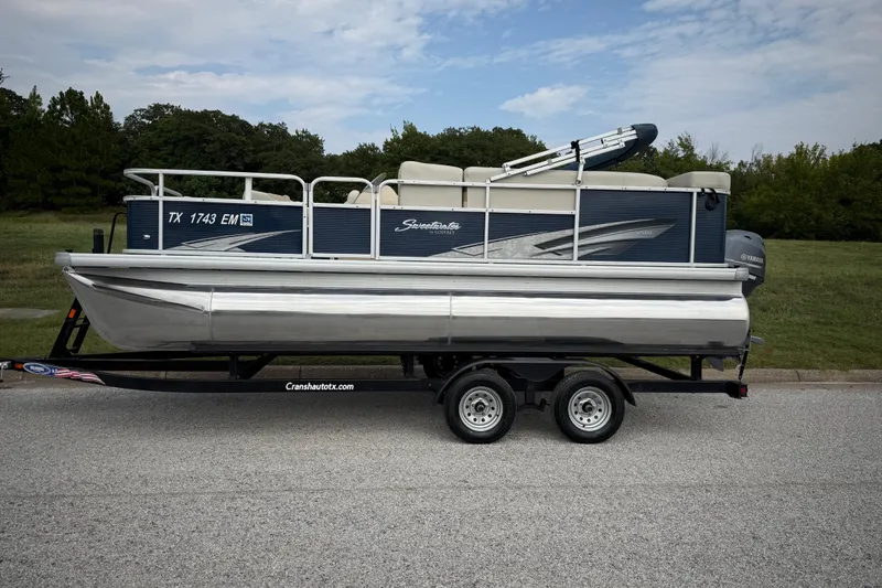 Slide: The Image of 2018 Sweetwater Sunrise 206 F pontoon boat on trailer by the water. - 7
