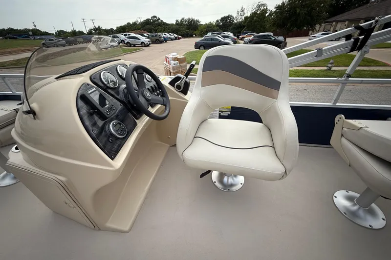Slide: The Image of 2018 Sweetwater Sunrise 206 F pontoon boat interior with steering console and seating. - 72