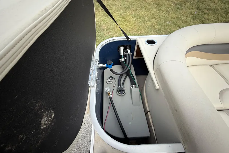 Slide: The Image of Storage compartment of a 2018 Sweetwater Sunrise 206 F boat, showing interior details. - 74