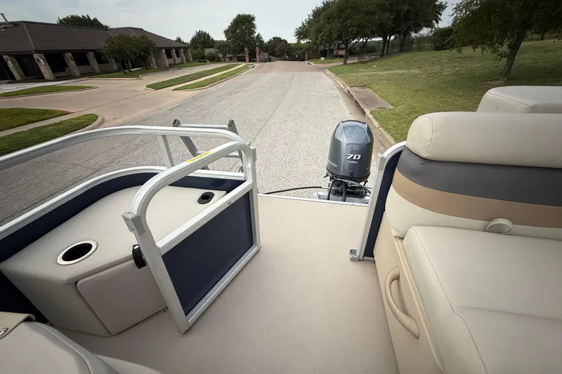 Slide: The Image of 2018 Sweetwater Sunrise 206 F pontoon boat with Yamaha 70 outboard motor on a street. - 88