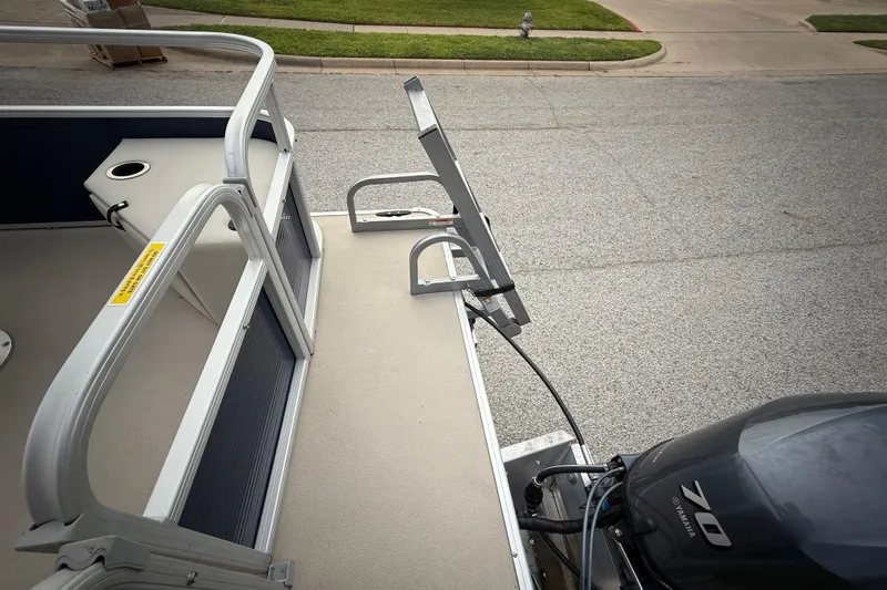 Slide: The Image of 2018 Sweetwater Sunrise 206 F pontoon boat with Yamaha motor, docked on a street. - 91