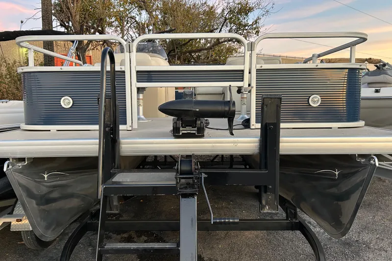 Slide: The Image of 2018 Sweetwater Sunrise 206 F pontoon boat, rear view with ladder and motor. - 92