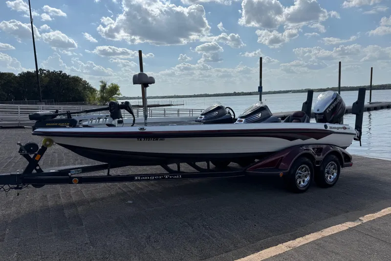 Slide: The Image of 2014 Ranger Z520 Comanche boat with powerful outboard motor on a sunny day. - 22