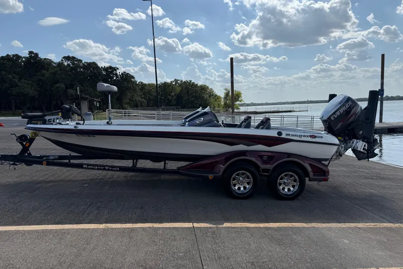 Slide: The Image of Close-up of a 2014 Ranger Z520 Comanche boat propeller on a concrete surface. - 24