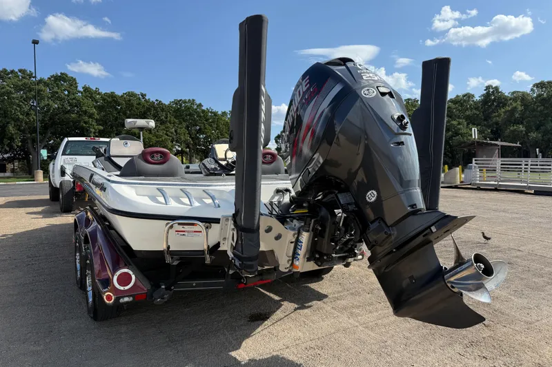Slide: The Image of 2014 Ranger Z520 Comanche trailer wheel with radial tire on concrete surface. - 29