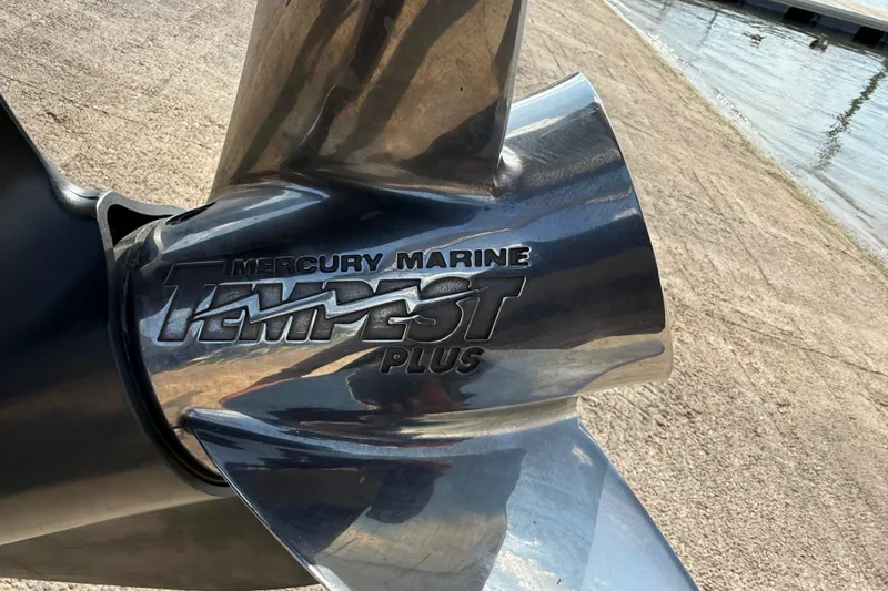 Slide: The Image of 2014 Ranger Z520 Comanche trailer with shiny chrome wheels and maroon fender. - 33