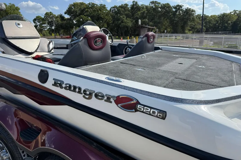 Slide: The Image of Close-up of a 2014 Ranger Z520 Comanche trailer tire with shiny chrome wheel. - 35