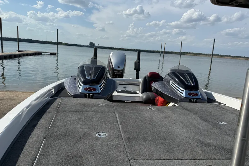 Slide: The Image of 2014 Ranger Z520 Comanche boat interior with seats and steering wheel, parked on pavement. - 40
