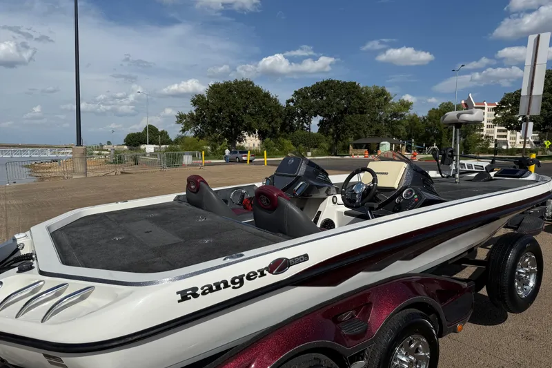 Slide: The Image of 2014 Ranger Z520 Comanche boat with open storage compartment on deck. - 41