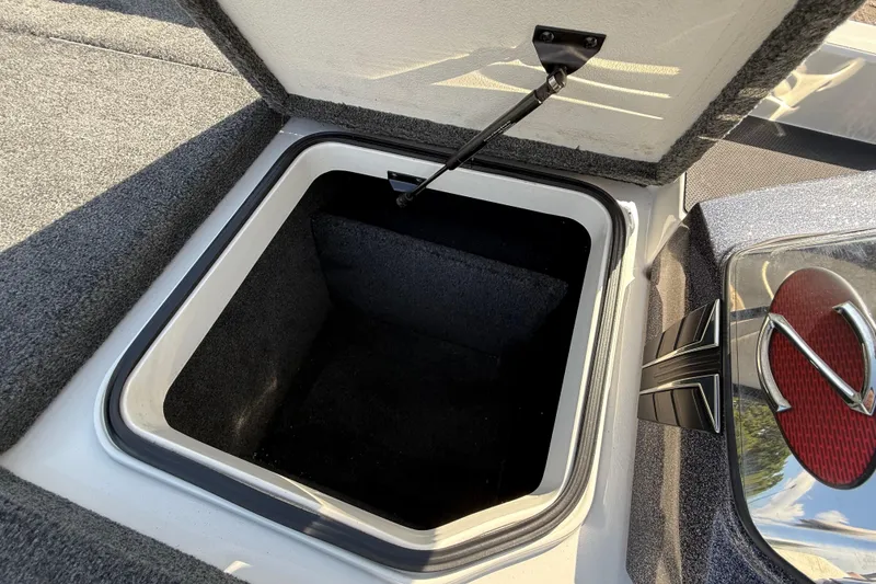 Slide: The Image of Open storage compartment in 2014 Ranger Z520 Comanche boat with gas strut and fire extinguisher. - 45