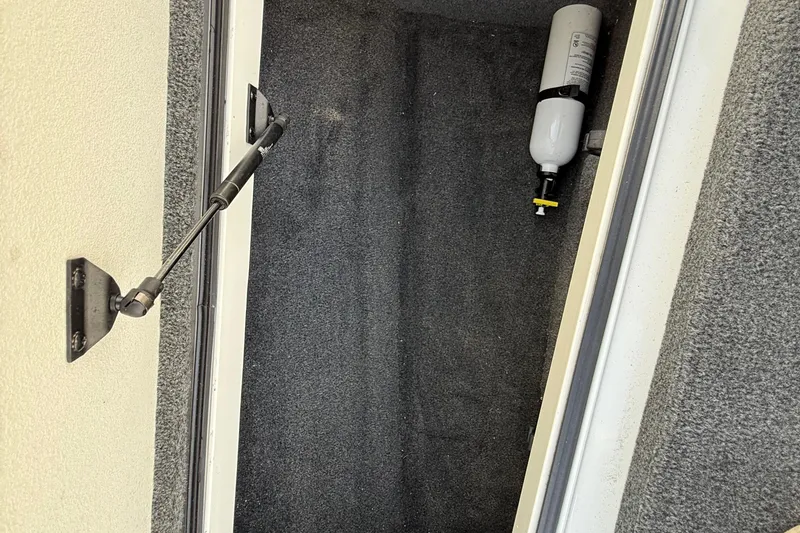 Slide: The Image of 2014 Ranger Z520 Comanche boat interior with dual seats, docked by a serene lake. - 47