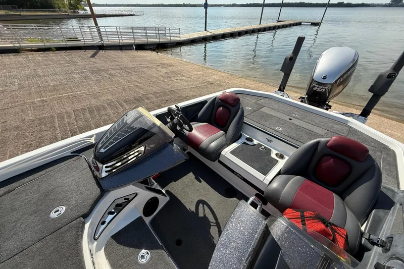 Slide: The Image of 2014 Ranger Z520 Comanche boat interior with storage compartments and cup holders. - 49