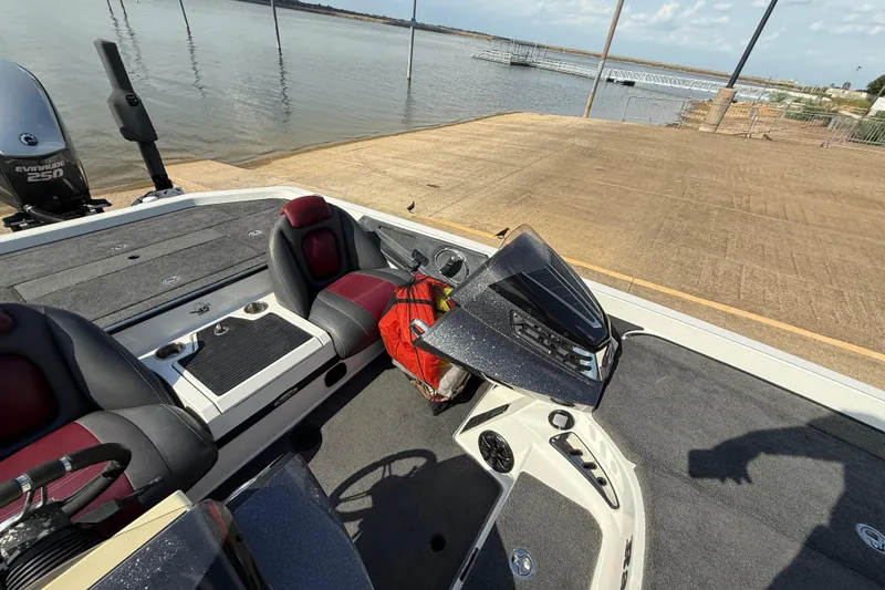 Slide: The Image of 2014 Ranger Z520 Comanche boat interior with steering wheel and dashboard controls. - 50