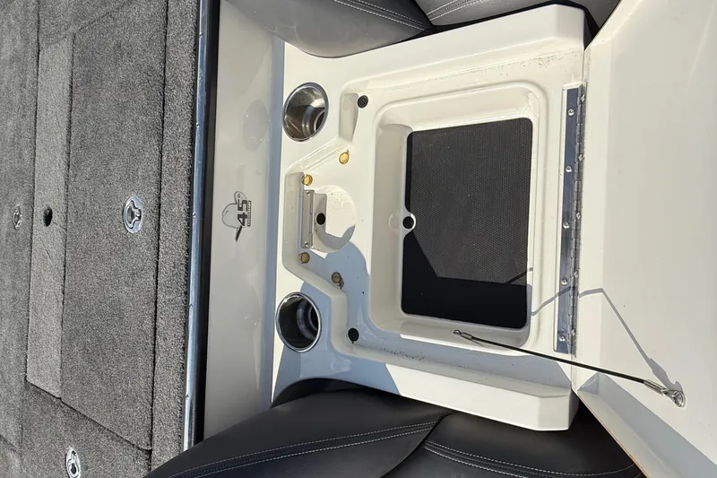 Slide: The Image of 2014 Ranger Z520 Comanche boat dashboard with controls and steering wheel. - 51