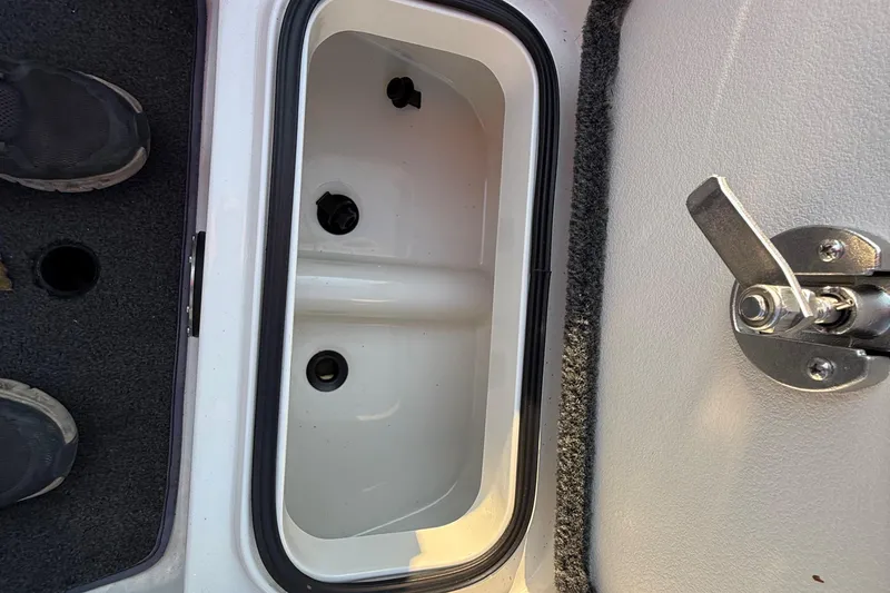 Slide: The Image of 2014 Ranger Z520 Comanche boat interior with plush seating and modern dashboard. - 59