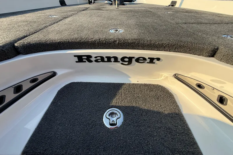 Slide: The Image of 2014 Ranger Z520 Comanche boat interior with dual seats and storage compartments. - 60