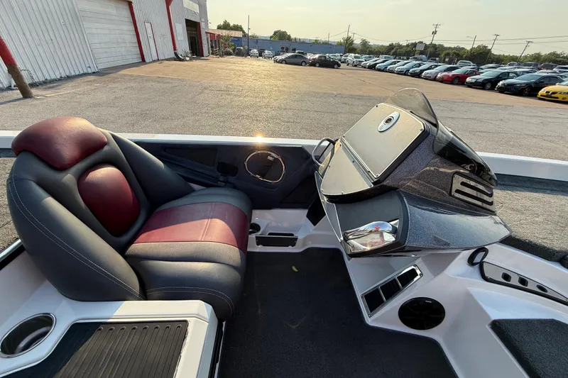 Slide: The Image of Control panel of a 2014 Ranger Z520 Comanche boat with gauges and switches. - 61
