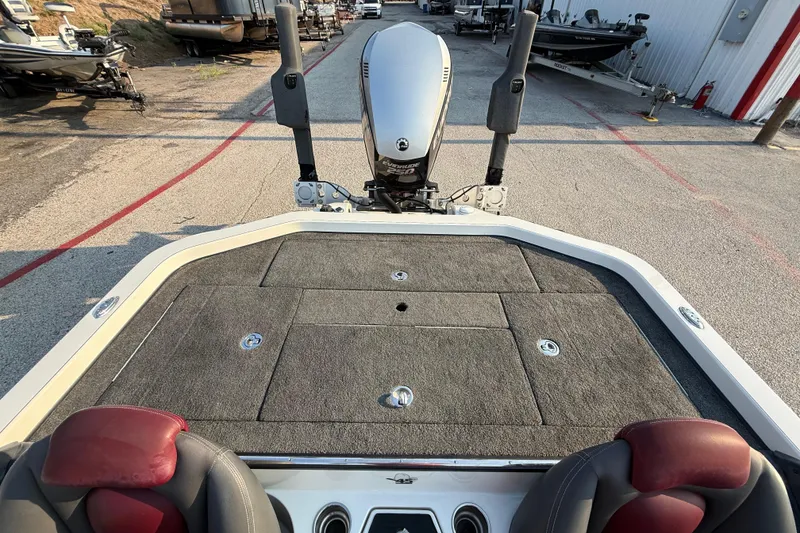 Slide: The Image of Open storage compartment in 2014 Ranger Z520 Comanche boat, featuring carpeted interior. - 66