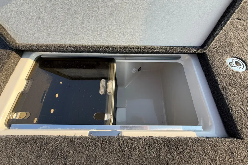 Slide: The Image of 2014 Ranger Z520 Comanche storage compartment with carpeted interior. - 68