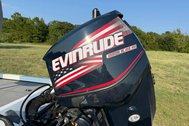 Slide: The Image of Evinrude E-TEC outboard motor on 2008 Bee Line 286 Pro Vee boat. - 16