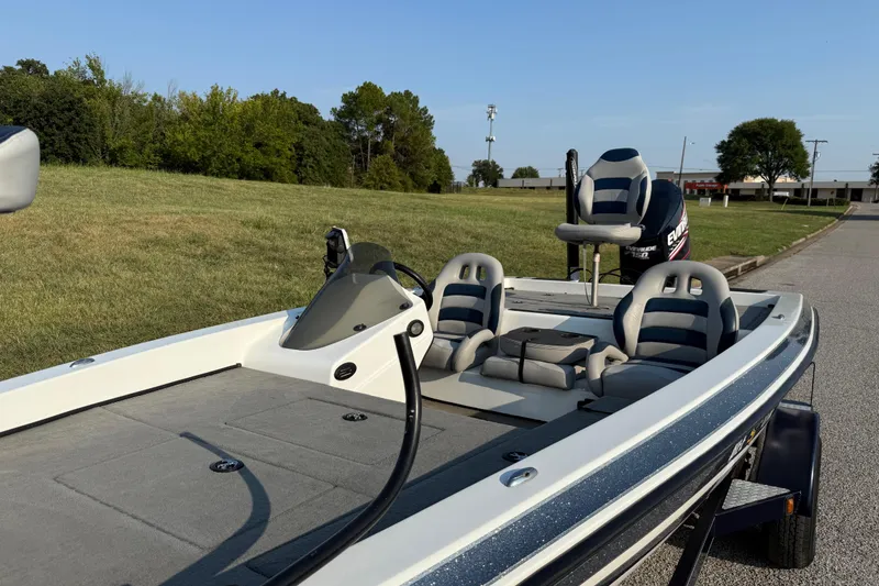 Slide: The Image of 2008 Bee Line 286 Pro Vee boat with seating, parked on a grassy area. - 19