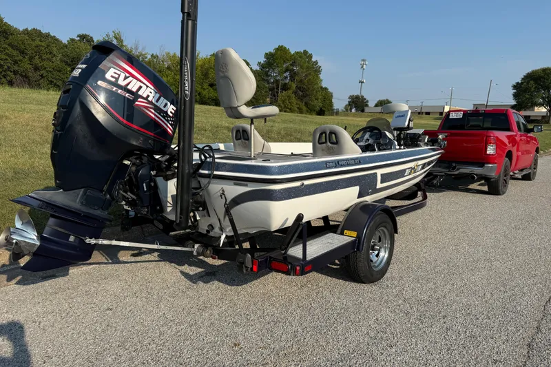Slide: The Image of 2008 Bee Line 286 Pro Vee boat on trailer, hitched to red truck. - 28