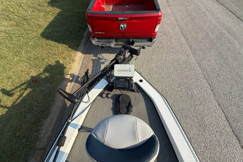 Slide: The Image of 2008 Bee Line 286 Pro Vee boat with Garmin equipment, parked behind a red truck. - 31