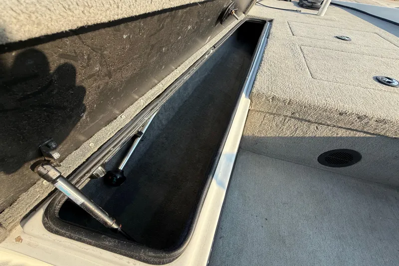 Slide: The Image of Open storage compartment in 2008 Bee Line 286 Pro Vee boat, showcasing interior details. - 34