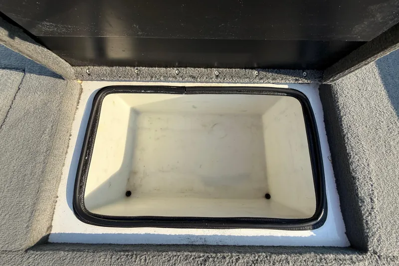 Slide: The Image of Open storage compartment in 2008 Bee Line 286 Pro Vee boat. - 36