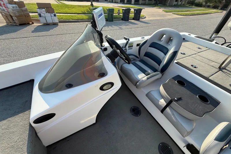 Slide: The Image of 2008 Bee Line 286 Pro Vee boat interior with steering wheel and seating. - 37