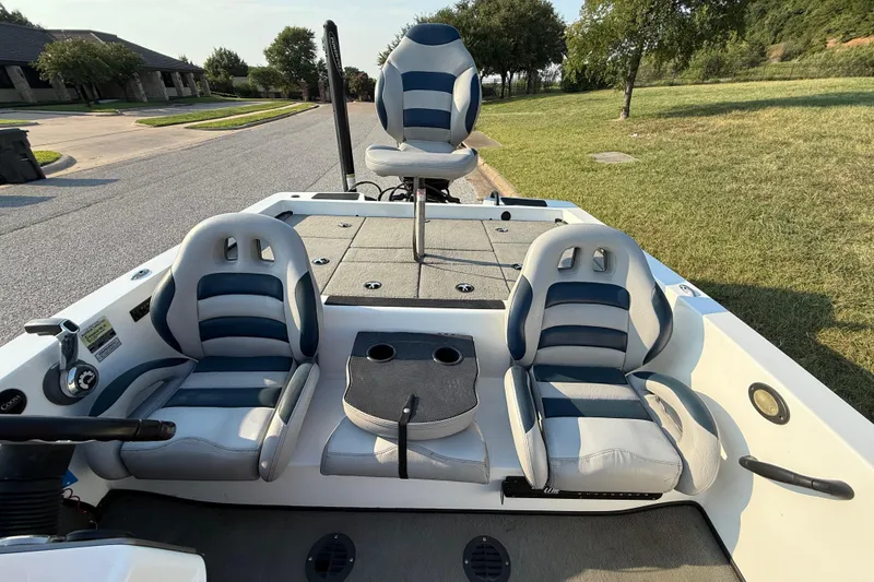Slide: The Image of 2008 Bee Line 286 Pro Vee boat interior with cushioned seating and steering console. - 39