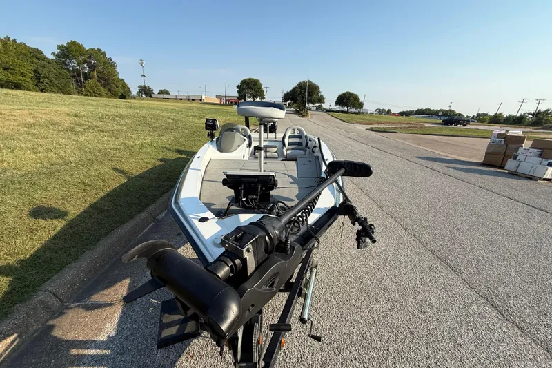 Slide: The Image of 2008 Bee Line 286 Pro Vee boat parked on a sunny day, showcasing its sleek design. - 4
