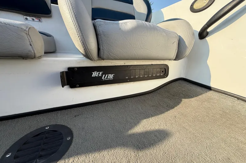 Slide: The Image of 2008 Bee Line 286 Pro Vee boat interior with gray seating and measurement panel. - 41