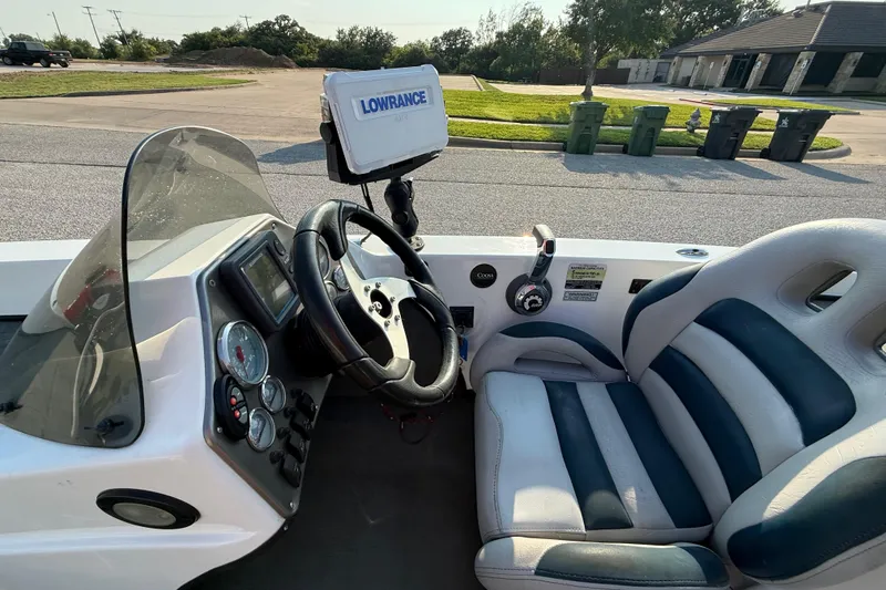 Slide: The Image of 2008 Bee Line 286 Pro Vee boat cockpit with steering wheel and navigation system. - 42