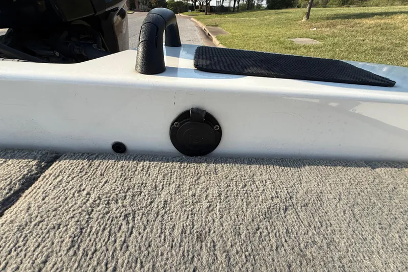 Slide: The Image of 2008 Bee Line 286 Pro Vee boat interior with carpeted deck and handle. - 48