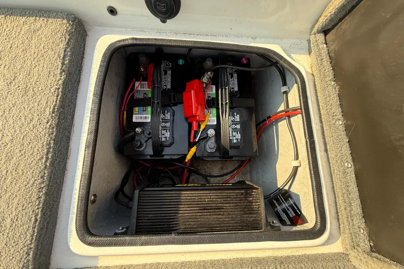 Slide: The Image of Battery compartment of 2008 Bee Line 286 Pro Vee boat with wiring and components. - 50
