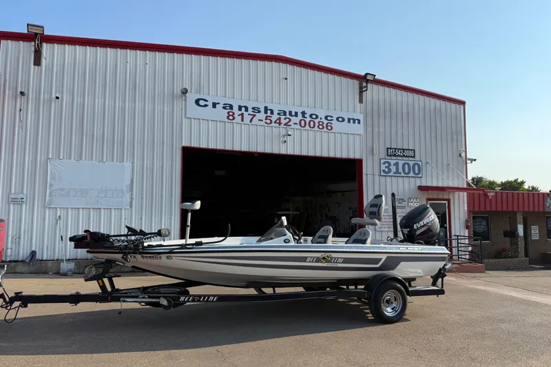 Slide: The Image of 2008 Bee Line 286 Pro Vee boat on trailer outside Cransh Auto building. - 56