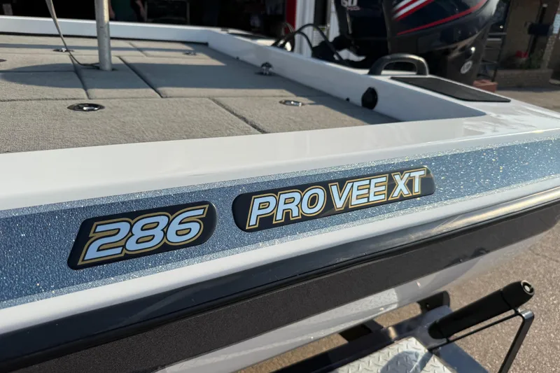 Slide: The Image of 2008 Bee Line 286 Pro Vee XT boat, close-up of model name on hull. - 58