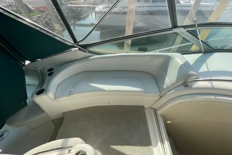 Slide: The Image of 1999 Silverton 360 Express boat interior with cushioned seating and carpeted floor. - 12