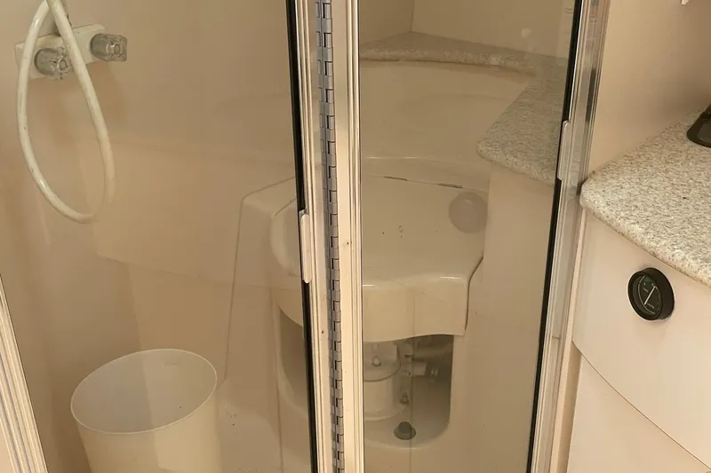 Slide: The Image of 1999 Silverton 360 Express bathroom with shower and countertop. - 19