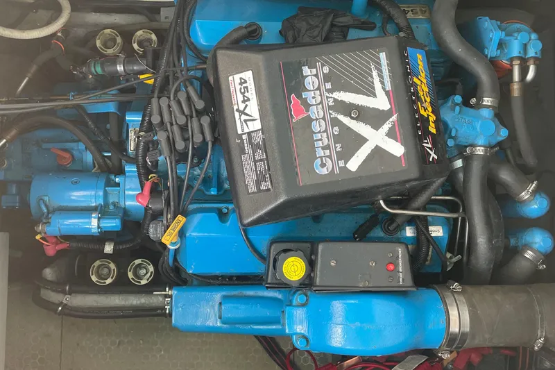 Slide: The Image of Engine of a 1999 Silverton 360 Express boat, featuring a Crusader XL engine. - 21