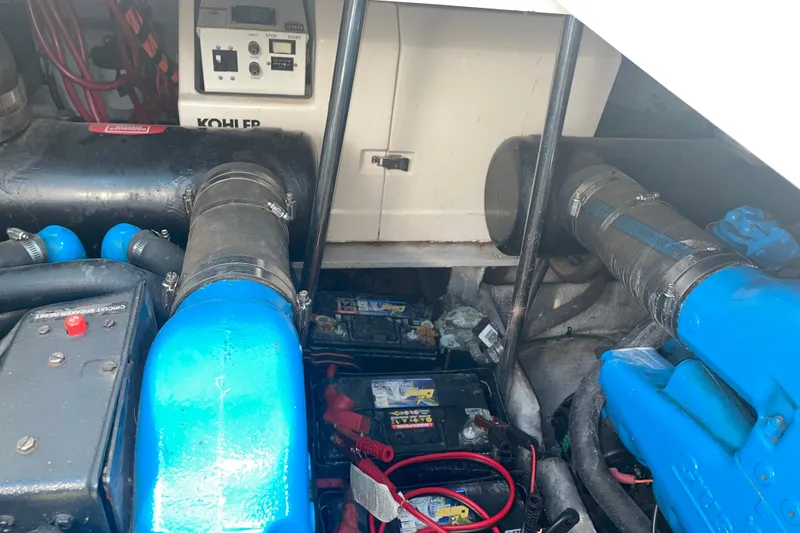 Slide: The Image of Engine compartment of a 1999 Silverton 360 Express boat with visible components and wiring. - 22