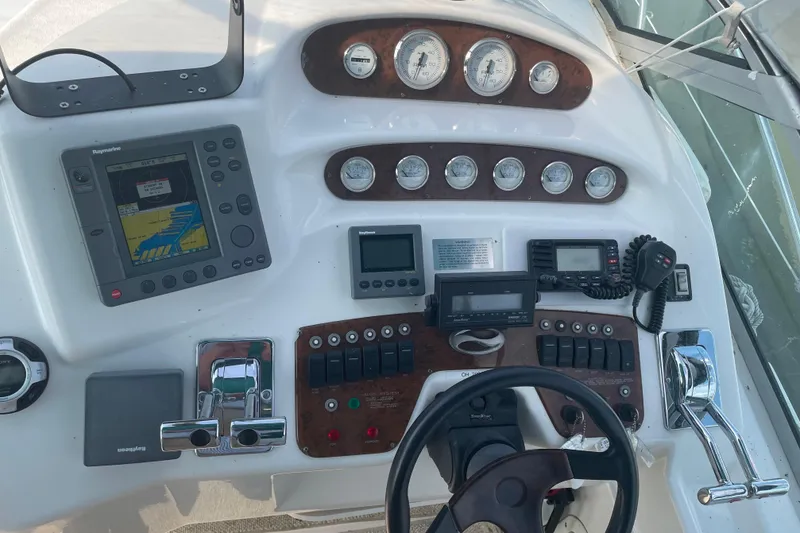 Slide: The Image of 1999 Silverton 360 Express boat dashboard with navigation and control instruments. - 6