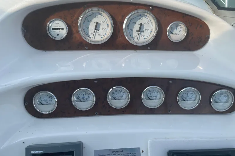 Slide: The Image of Dashboard of a 1999 Silverton 360 Express boat with various gauges and dials. - 7