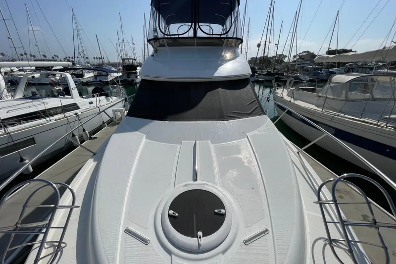 Slide: The Image of 2008 Meridian 341 Sedan yacht docked in marina, surrounded by sailboats. - 11