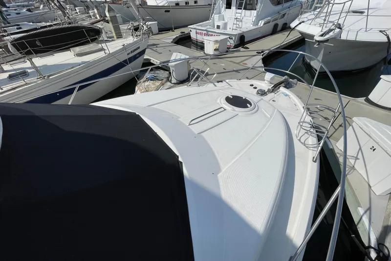 Slide: The Image of 2008 Meridian 341 Sedan yacht docked at marina, surrounded by other boats. - 14