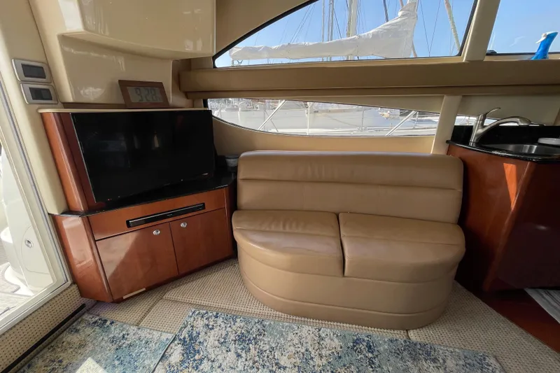 Slide: The Image of Interior of 2008 Meridian 341 Sedan with leather seating, TV, and window view. - 18